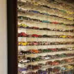 memorabilia collage displaying miniature cars for Images Custom Framing